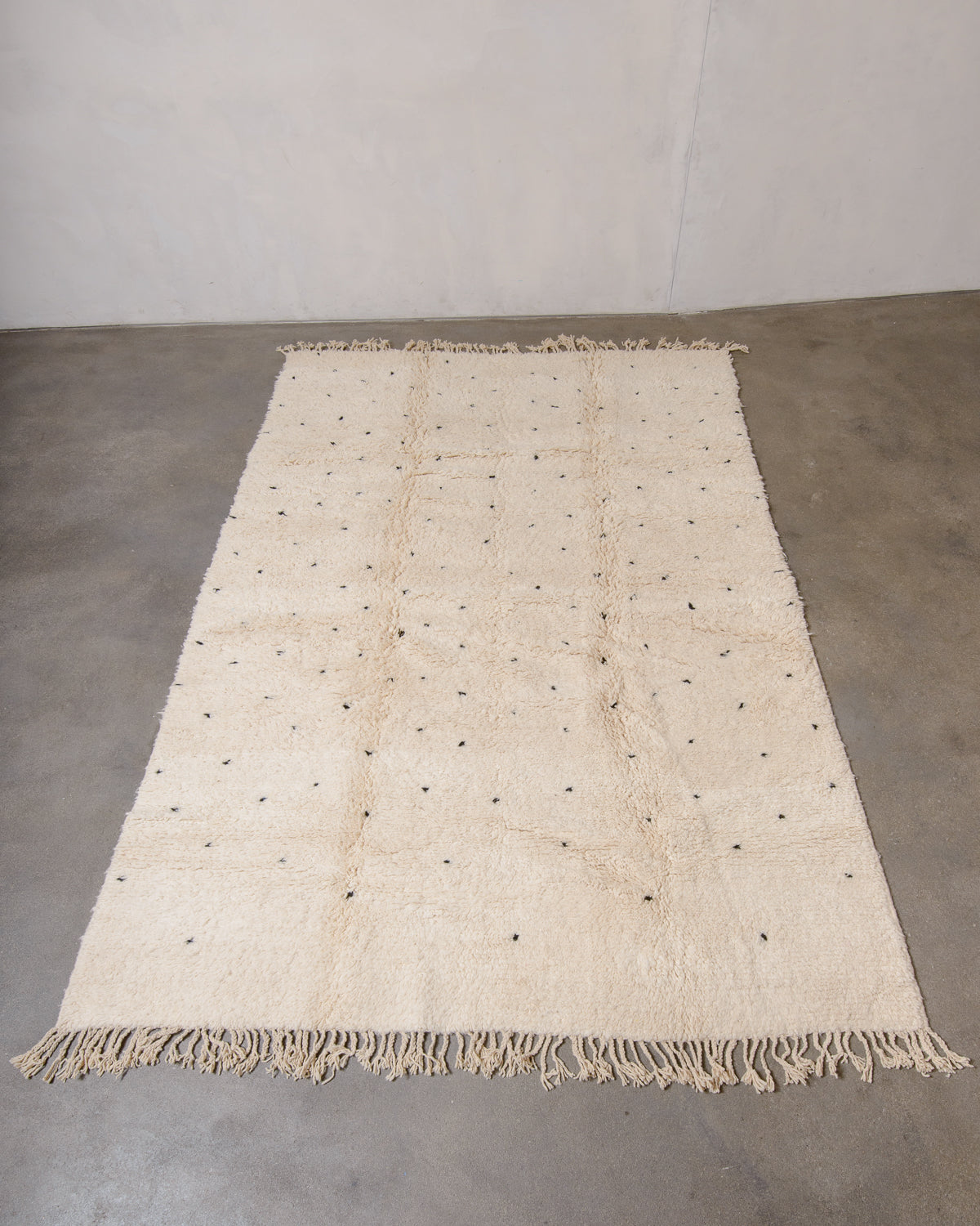 Modern, designer, handcrafted Berber rug from Morocco. Beniourain carpet with minimalist design, natural wool pile and a fluffy texture.